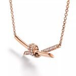Knot Pendant Necklace with Zirconia · 18K Gold Plated · Adjustable Chain - Image 11